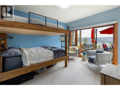 Main floor bedroom with Queen over Queen custom bunks at 9845 Eastside Road Unit# 144, Okanagan Landing, Vernon