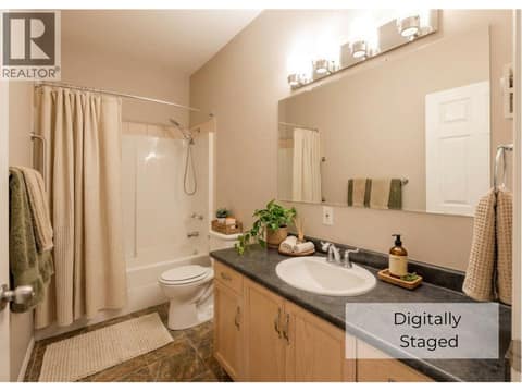 Bathroom digitally staged at 650 MCKINNEY Road Unit# 325, Oliver