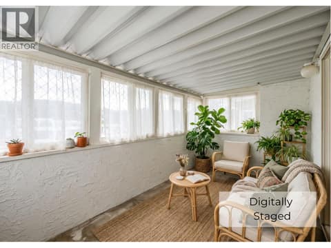 Covered deck sunroom digitally staged at 650 MCKINNEY Road Unit# 325, Oliver