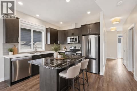 This photo has been digitally staged at 1939 COLDWATER Drive Unit# 106, Juniper Ridge, Kamloops