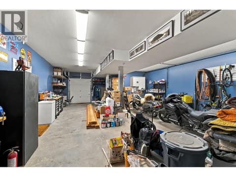 Extra large 3 car garage with garage door access front and back at 6976 Terazona Drive, Fintry, Kelowna