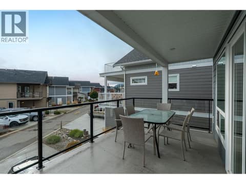 Partially covered patio off kitchen and living room at 6976 Terazona Drive, Fintry, Kelowna