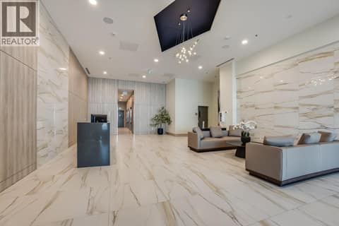 Building lobby with a concierge desk at 1626 Water Street Unit# 1804, Kelowna North