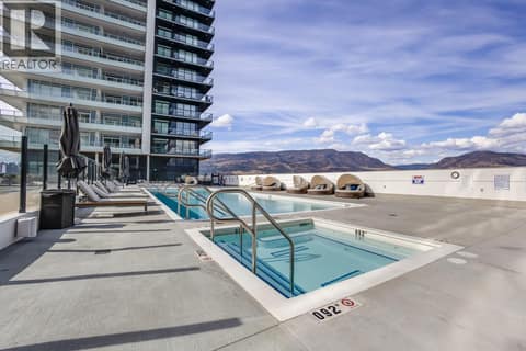 Large outdoor pool with two year round hot tubs at 1626 Water Street Unit# 1804, Kelowna North