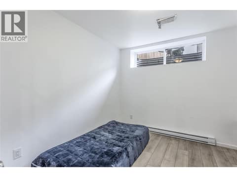 Legal suite has plenty of natural light, and supplementary baseboard heat source at 705 Stoltz Court, Rutland North, Kelowna