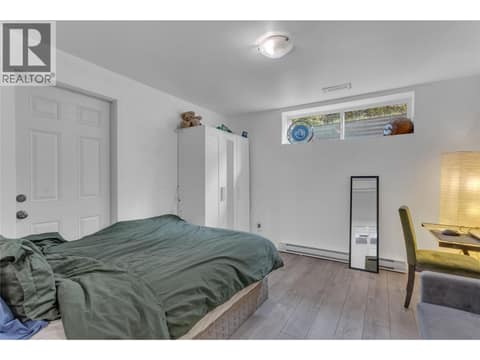 Legal suite primary bedroom at 705 Stoltz Court, Rutland North, Kelowna