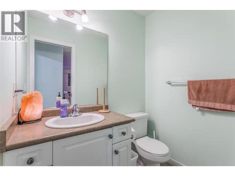 Main floor powder room at 705 Stoltz Court, Rutland North, Kelowna
