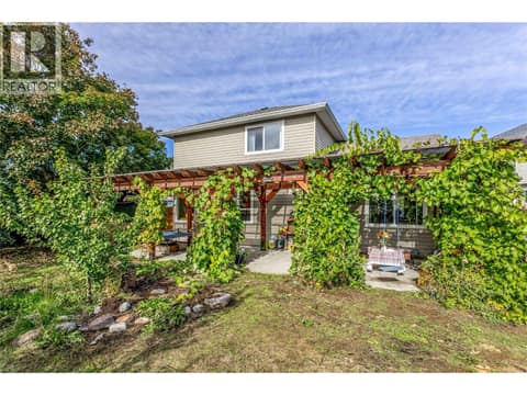 Pergola with well established grape vines at 705 Stoltz Court, Rutland North, Kelowna