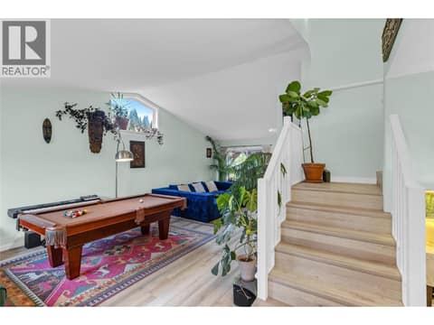 Step into spacious living room area complete with new vinyl flooring in 2022. at 705 Stoltz Court, Rutland North, Kelowna