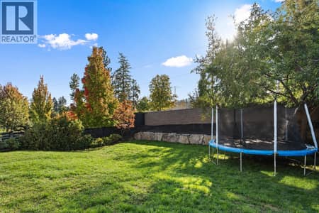 Pool sized, private yard at 515 Wren Place Unit# 133, Upper Mission, Kelowna