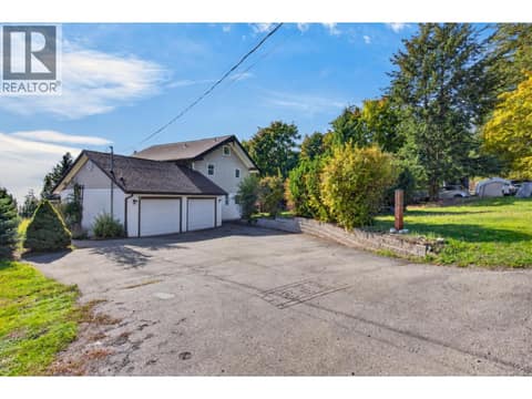 Double garage with an expansive driveway and plenty of additional parking. at 359 Kildare Way, Okanagan North, Vernon