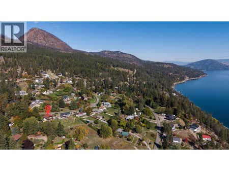 Just minutes from the lake and Killiney Beach Park, this warm and distinctive Okanagan home offers character, privacy, space, and an exceptional setting. at 359 Kildare Way, Okanagan North, Vernon