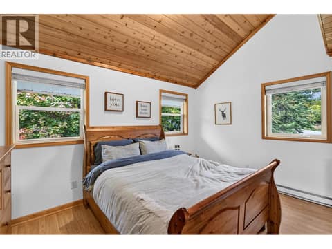 Primary bedroom with vaulted wood ceilings. at 359 Kildare Way, Okanagan North, Vernon
