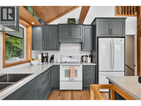Recently renovated kitchen features stylish cabinetry, updated countertops, and a new fridge. at 359 Kildare Way, Okanagan North, Vernon