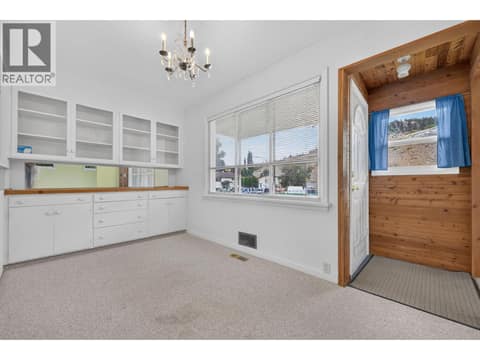 Dining room with builtins at 879 Trench Court, Kelowna North