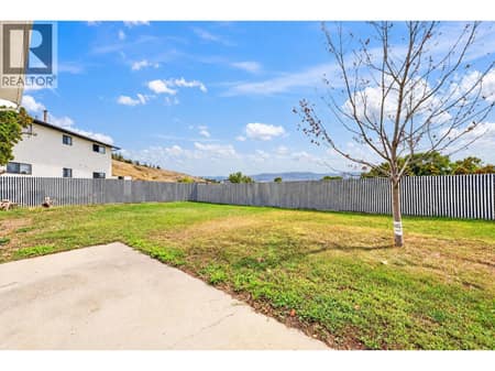 Large private backyard at 879 Trench Court, Kelowna North