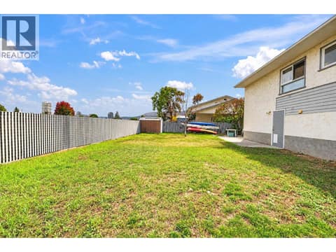 Large private backyard at 879 Trench Court, Kelowna North