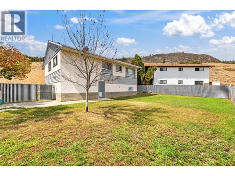 Large, private backyard at 879 Trench Court, Kelowna North