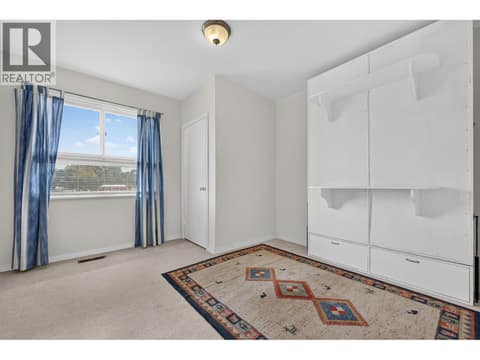 Second bedroom with Murphy bed at 879 Trench Court, Kelowna North