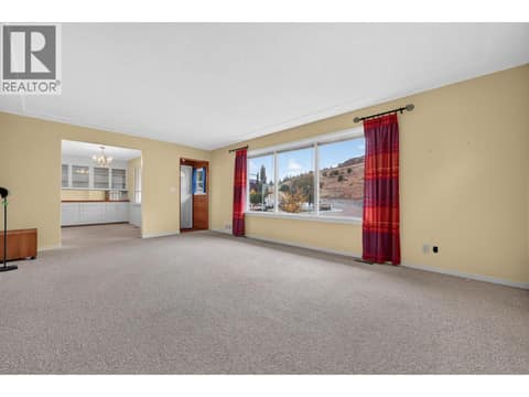 Spacious living room at 879 Trench Court, Kelowna North