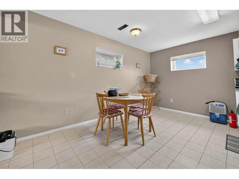 Suite dining room and kitchen at 879 Trench Court, Kelowna North