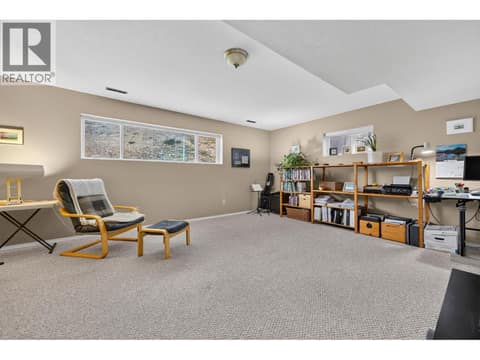 Suite living room at 879 Trench Court, Kelowna North