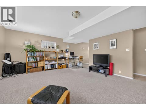 Suite living room at 879 Trench Court, Kelowna North