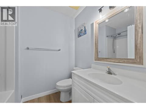 Bathroom #2 | Main Level - 4 piece bathroom with new toilet & flooring at 3220 McIver Road, Glenrosa, West Kelowna