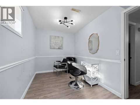 Den | Lower Level - With new laminate flooring through out at 3220 McIver Road, Glenrosa, West Kelowna