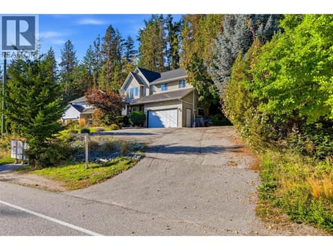 Generous driveway with plenty of room for vehicles, a trailer, boat and recreational toys! at 3220 McIver Road, Glenrosa, West Kelowna