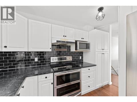 Kitchen | Main Level - with stainless steel appliances at 3220 McIver Road, Glenrosa, West Kelowna