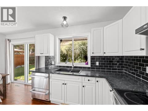 Kitchen | Main Level - with stainless steel appliances at 3220 McIver Road, Glenrosa, West Kelowna