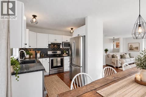 Kitchen | Main Level - with stainless steel appliances ** PARTIAL VIRTUAL STAGING & AI GENERATED ** at 3220 McIver Road, Glenrosa, West Kelowna