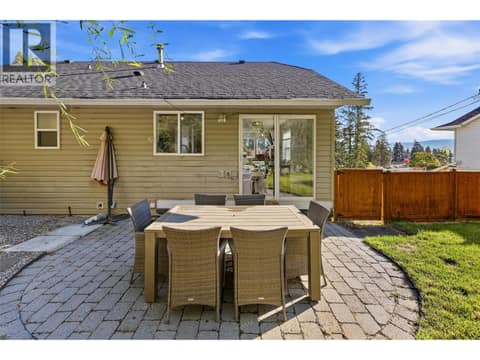 Patio & Backyard Space | Main Level - Private backyard with hot tub & full fencing at 3220 McIver Road, Glenrosa, West Kelowna