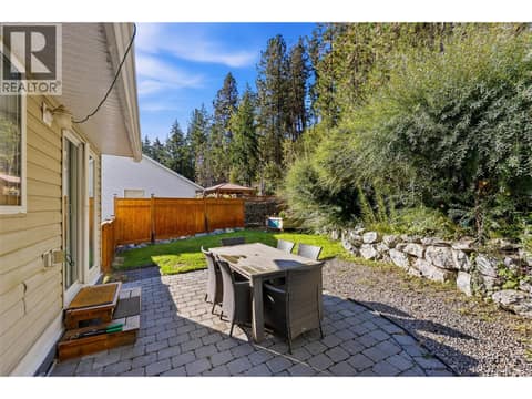 Patio & Backyard Space | Main Level - Private backyard with hot tub & full fencing at 3220 McIver Road, Glenrosa, West Kelowna