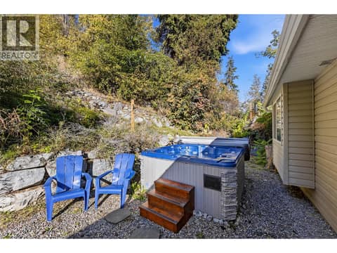 Patio & Backyard Space | Main Level - Private backyard with hot tub & full fencing at 3220 McIver Road, Glenrosa, West Kelowna