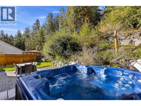 Patio & Backyard Space | Main Level - Private backyard with hot tub & full fencing at 3220 McIver Road, Glenrosa, West Kelowna