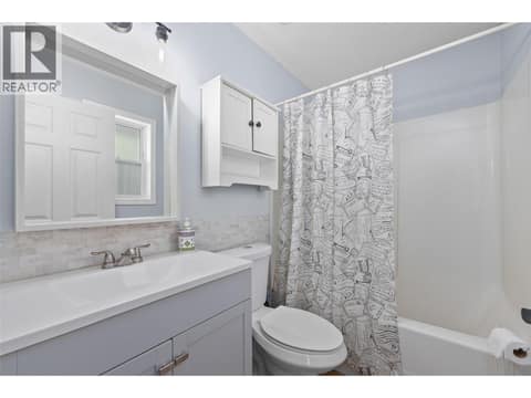 Primary Ensuite | Main Level (Bathroom #1) - 4 piece ensuite with new sink, toilet & flooring at 3220 McIver Road, Glenrosa, West Kelowna
