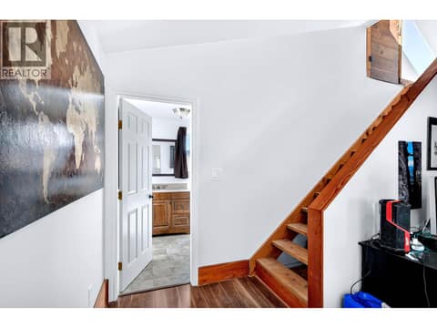 Stairs to the primary bedroom at 9524 Tranquille Criss Creek Road, Red Lake, Kamloops