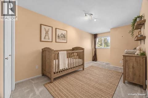 2nd bedroom with virtually staged furnishings at 884 Mission Springs Crescent, Lower Mission, Kelowna