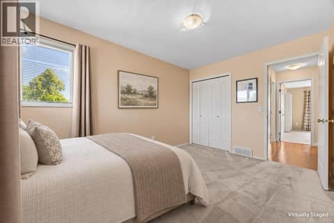 3rd bedroom with virtually staged furnishings at 884 Mission Springs Crescent, Lower Mission, Kelowna