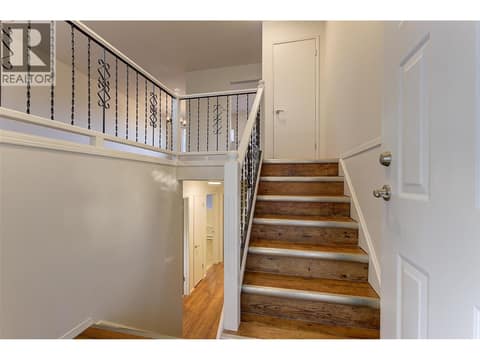 Cathedral Entry with laminate floors welcomes you in at 246 Briarwood Road, Rutland North, Kelowna