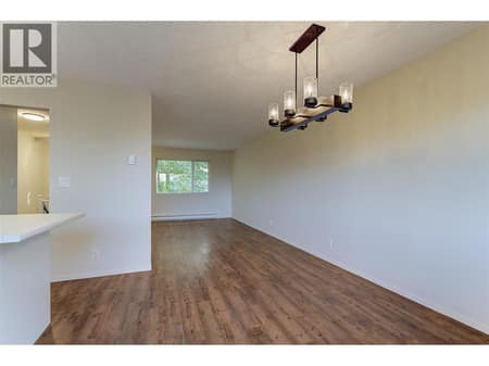 Dining room off kitchen with updated fixturing at 246 Briarwood Road, Rutland North, Kelowna