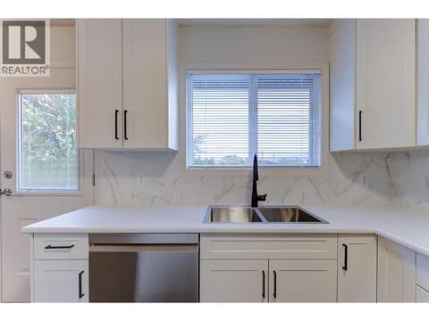 Window over sink, LG dishwasher, new shaker doors, sink, faucets,  counters at 246 Briarwood Road, Rutland North, Kelowna