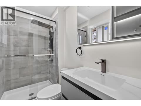 Ensuite cabinet with lighting at 10551 Sherman Drive, Lake Country East / Oyama