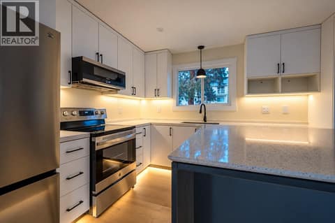 Stunning lighting to highlight the kitchen at 10551 Sherman Drive, Lake Country East / Oyama