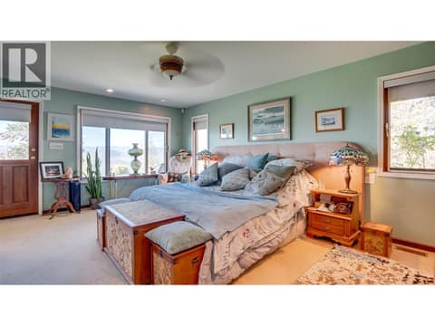 The primary bedroom has a separate door to the backyard and hot tub. at 3200 Greenwood Road, South BX, Vernon