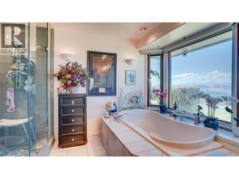 This soaker tub in the ensuite has amazing private views! at 3200 Greenwood Road, South BX, Vernon
