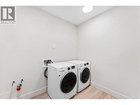 Second lower level laundry area at 10313 Long Road, Lake Country South West