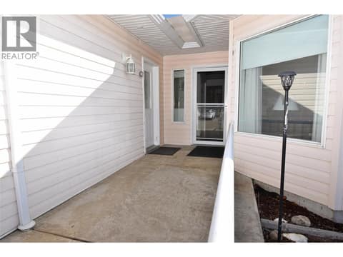 Front door and side door to garage at 5309 21 Street, Harwood, Vernon